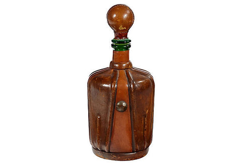 vintage glass decanter with leather cover